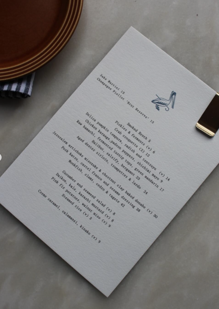 Flat lay shot of the menu and table at the Blue Pelican, Deal