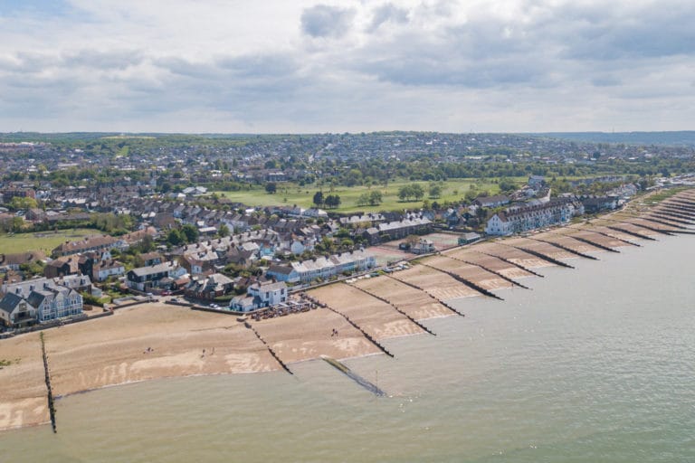 An aerial shot of the shoreline and town centre of Whitstable in Kent