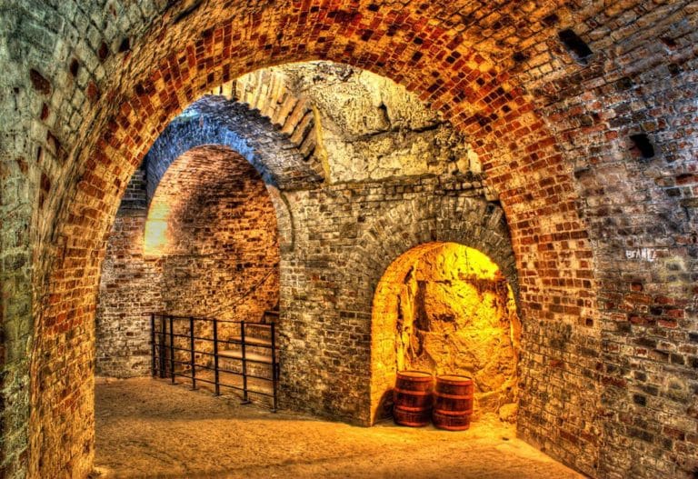 An atmospheric interior shot of the vaulted ceilings and archways at Fort Amherst, a Napoleonic fort dating back to 1756.