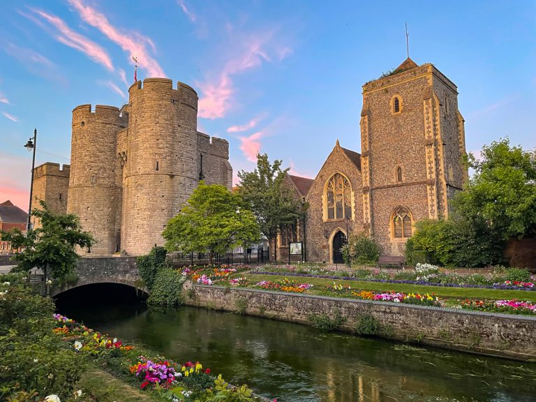 Colorful sunset clouds over medieval Westgate Towers and Guildhall in Canterbury, Kent