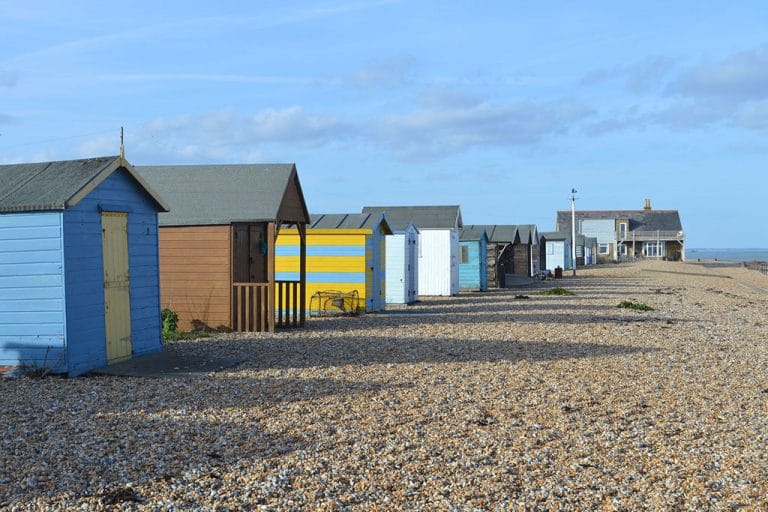 Row of colourful beach huts on Kingsdown Beach, Kent