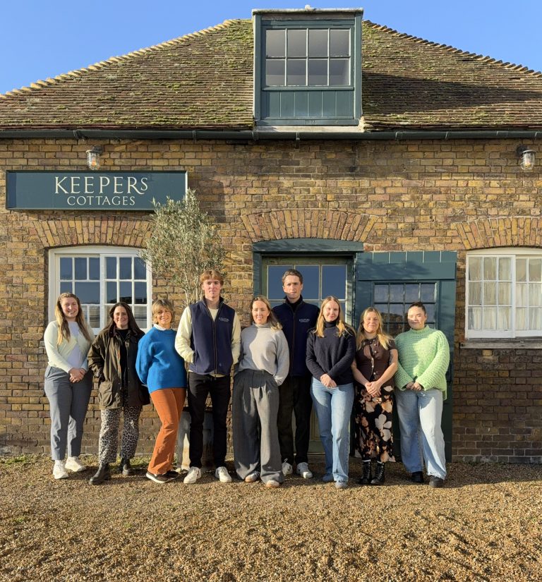 The team at Keepers Cottages outside their office on an autumnal day