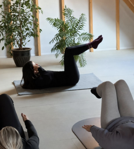 An image of three women taking part in mat pilates wellness session Kent