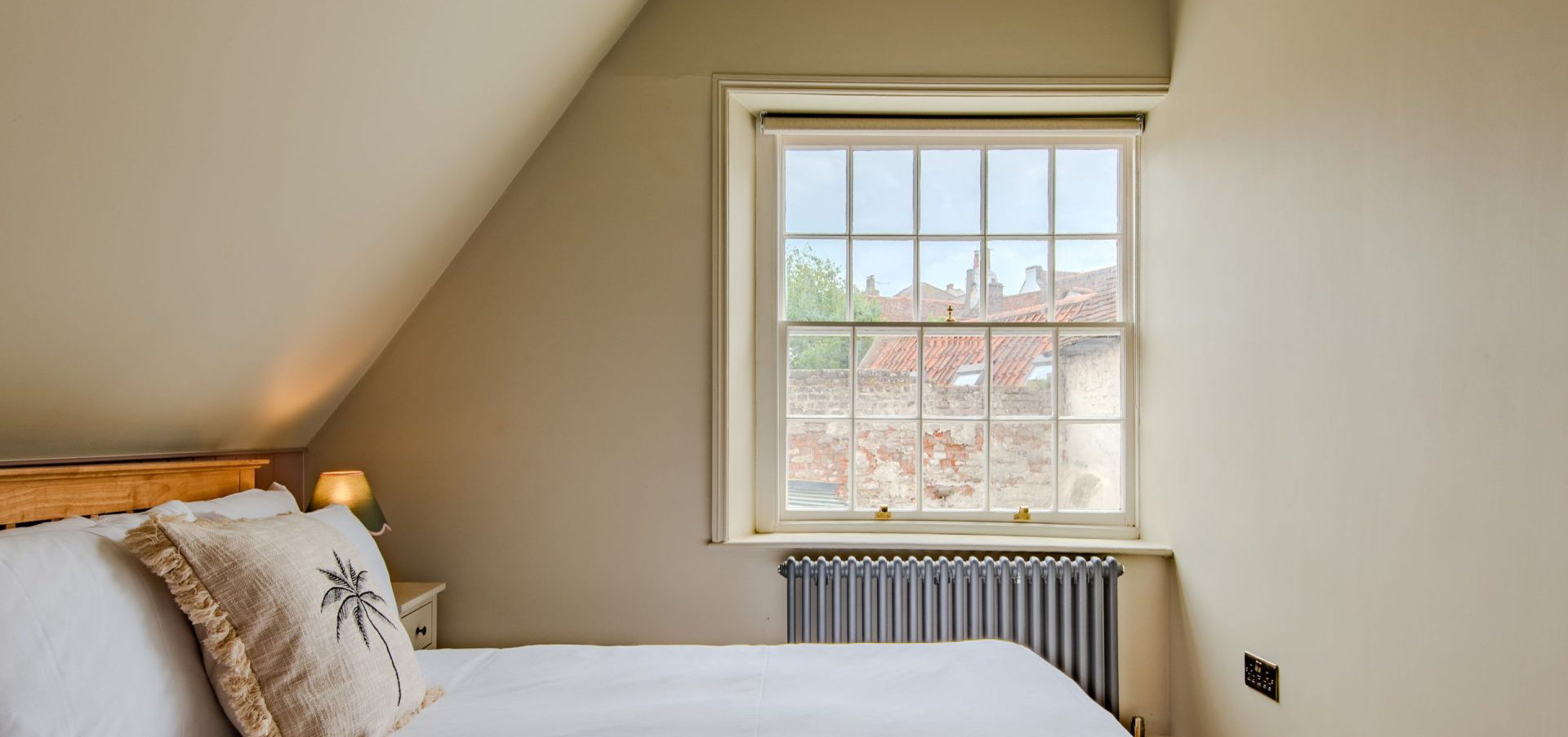 A cropped image of the attic bedroom in Narayan cottage Deal