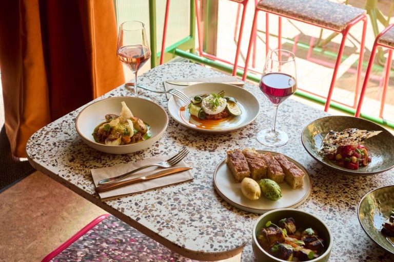 A table spread of dishes and drinks at Pomus in Margate