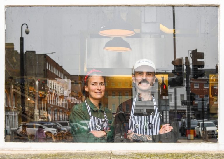 The owners of margate bakery Madre looking out through the window